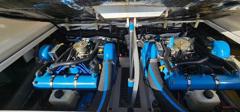 Slide: The Image of Twin blue engines in a 1994 Tiara Yachts 3100 Open boat. - 41