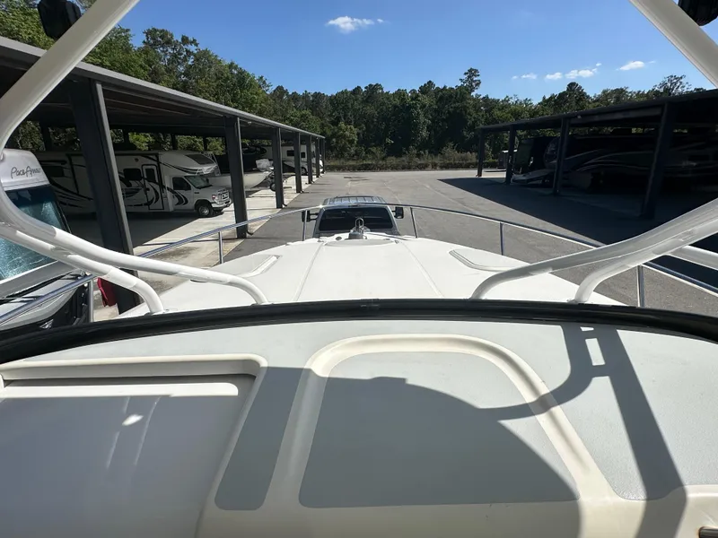 Slide: The Image of 2007 Hydra-Sports Vector 3300 VX boat in storage, surrounded by RVs and trees. - 13