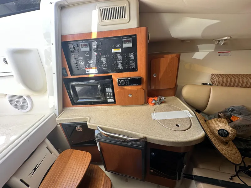 Slide: The Image of 2007 Hydra-Sports Vector 3300 VX cabin interior with control panel and kitchenette. - 17