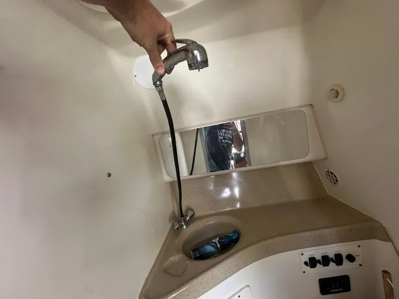 Slide: The Image of 2007 Hydra-Sports Vector 3300 VX boat interior with sink and mirror. - 18