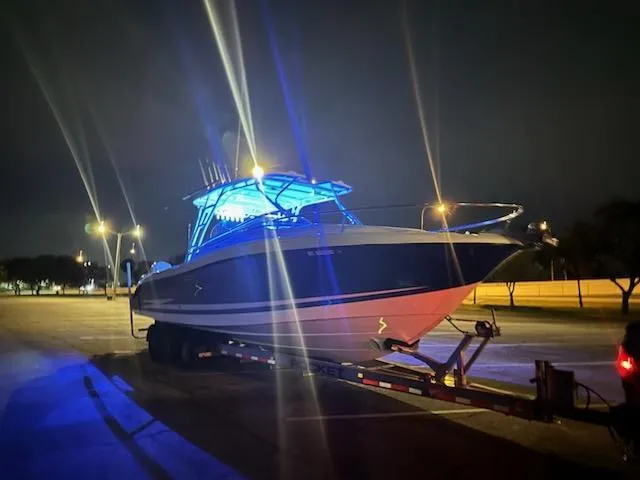 Slide: The Image of 2007 Hydra-Sports Vector 3300 VX boat on trailer, illuminated at night. - 3