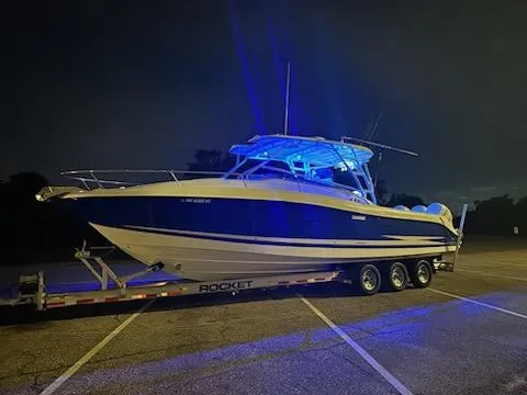 Slide: The Image of 2007 Hydra-Sports Vector 3300 VX boat on trailer, illuminated by blue lights at night. - 4