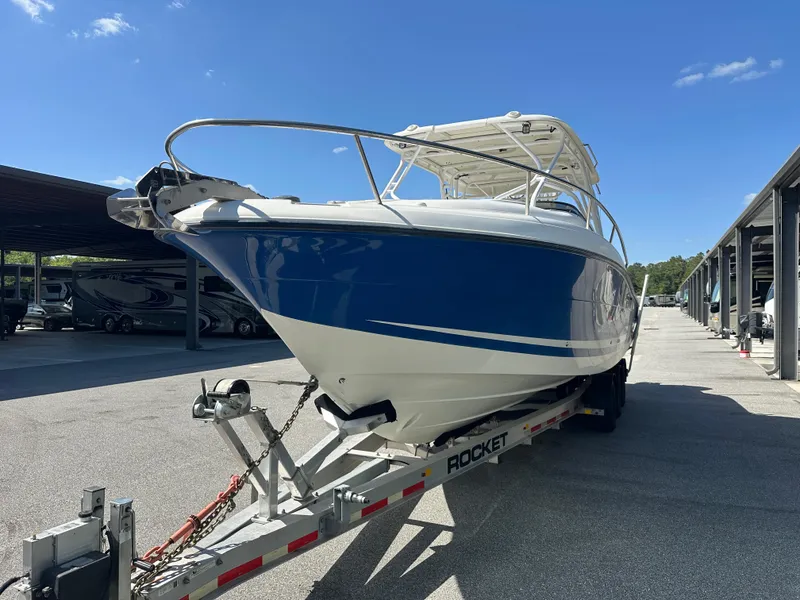 Slide: The Image of 2007 Hydra-Sports Vector 3300 VX boat on trailer in sunny marina setting. - 5