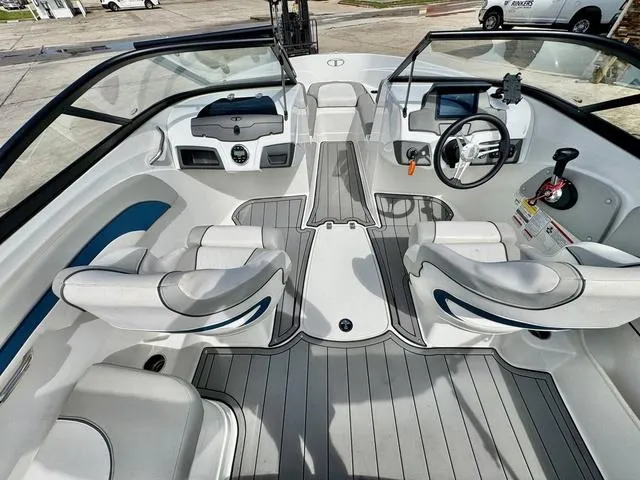 Slide: The Image of 2023 Tahoe 210 Si boat interior with modern dashboard and seating. - 12