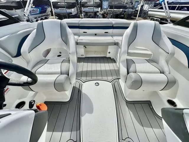 Slide: The Image of 2023 Tahoe 210 Si boat interior with white seating and sleek design. - 15