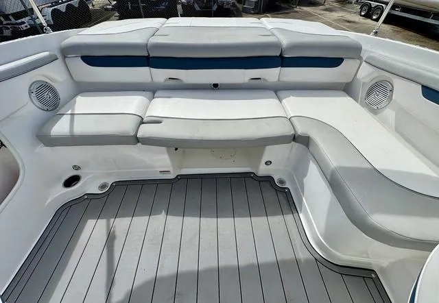 Slide: The Image of 2023 Tahoe 210 Si boat interior with cushioned seating and sleek design. - 16