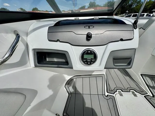 Slide: The Image of 2023 Tahoe 210 Si boat dashboard with modern controls and sleek design. - 19