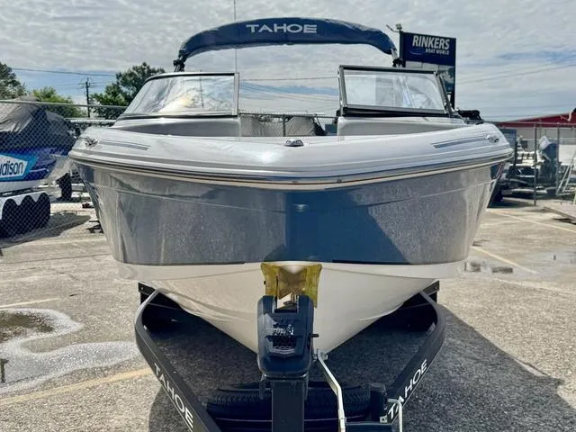 Slide: The Image of 2023 Tahoe 210 Si boat on trailer, front view, parked outdoors. - 4