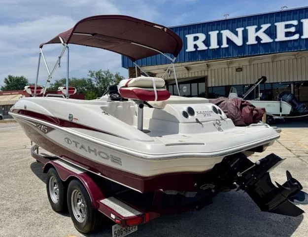 Slide: The Image of 2014 Tahoe 215 Xi boat on trailer, parked outside Rinker building. - 9