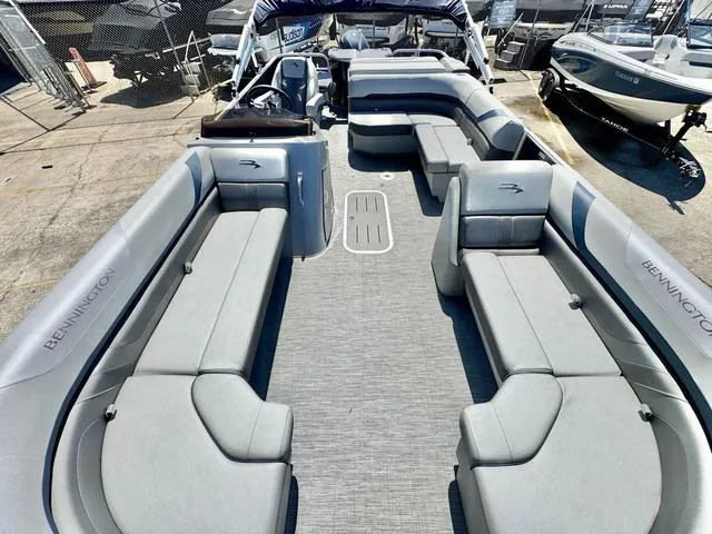 Slide: The Image of 2023 Bennington SX Fish 22 SXFAPG pontoon boat with spacious seating and modern design. - 10