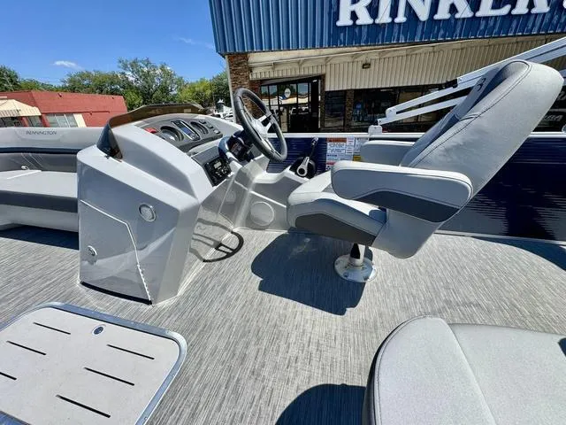 Slide: The Image of 2023 Bennington SX Fish 22 SXFAPG boat interior with steering console and seating. - 16