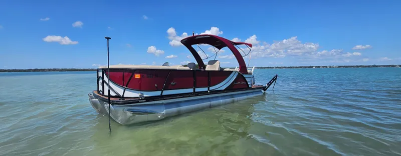 Slide: The Image of 2017 South Bay 500 pontoon boat on clear blue water under a sunny sky. - 12