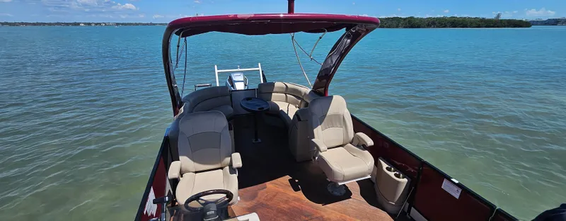 Slide: The Image of 2017 South Bay 500 boat interior with seating, on calm blue water. - 13