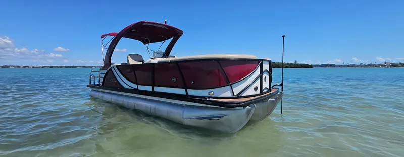 Slide: The Image of 2017 South Bay 500 pontoon boat on clear blue water under a sunny sky. - 2