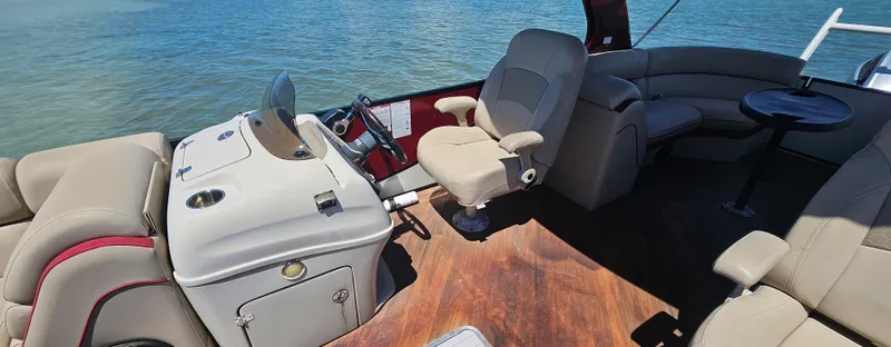 Slide: The Image of Interior of 2017 South Bay 500 boat with beige seating and wooden flooring. - 23