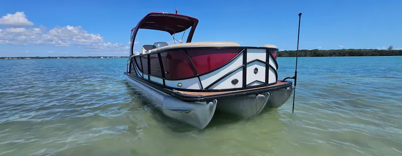 Slide: The Image of 2017 South Bay 500 pontoon boat on clear blue water under a sunny sky. - 5