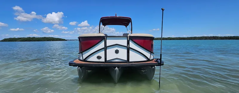 Slide: The Image of 2017 South Bay 500 pontoon boat on clear blue water under a sunny sky. - 7