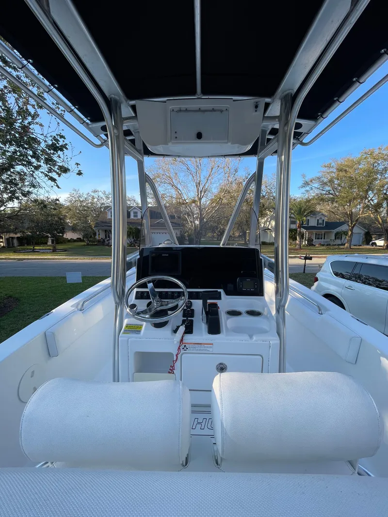 Slide: The Image of 2017 Sea Hunt 225 Ultra boat interior with steering console, 2021 trailer, 385 hours. - 13