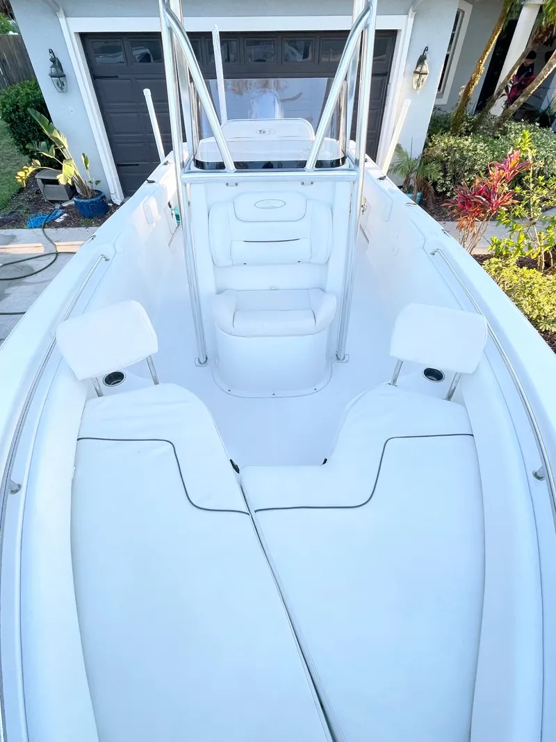 Slide: The Image of 2017 Sea Hunt 225 Ultra boat with spacious seating, shown with 2021 trailer. - 17