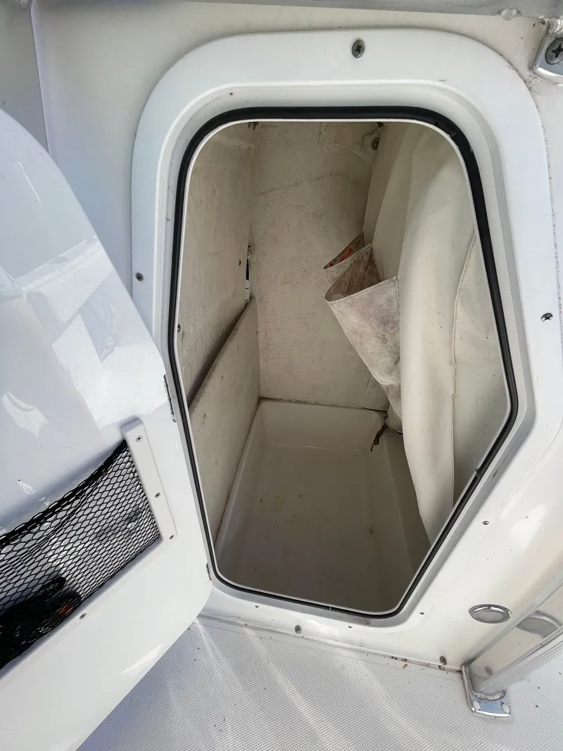 Slide: The Image of Storage compartment of 2017 Sea Hunt 225 Ultra boat, featuring clean interior space. - 27