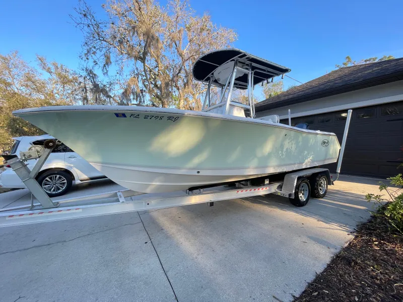 Slide: The Image of 2017 Sea Hunt 225 Ultra boat on trailer, parked in driveway, with 385 hours. - 4