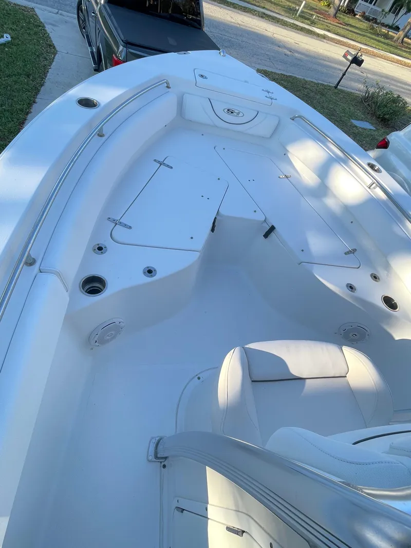 Slide: The Image of 2017 Sea Hunt 225 Ultra boat with trailer, spacious deck, and sleek design. - 7