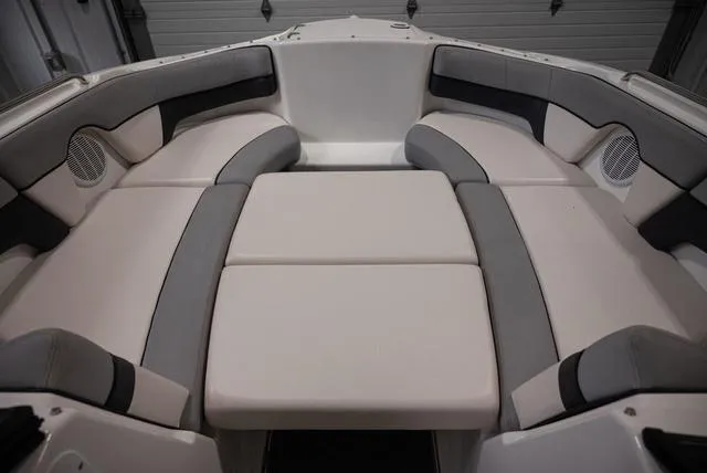 Slide: The Image of 2012 Yamaha Boats 212SS interior with cushioned seating and speakers. - 11