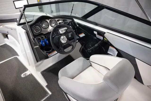 Slide: The Image of Interior of 2012 Yamaha Boats 212SS, featuring steering wheel and dashboard controls. - 7