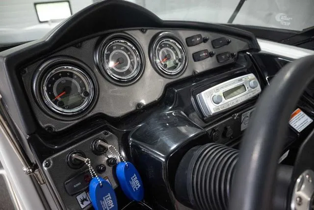 Slide: The Image of Dashboard of a 2012 Yamaha Boats 212SS, featuring gauges and a stereo system. - 8