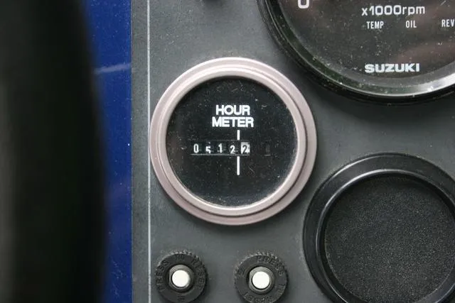 Slide: The Image of Hour meter reading 512.7 on 2003 Thunder Jet 19 Luxor boat dashboard. - 10