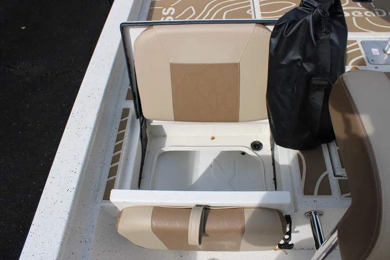 Slide: The Image of 2025 Xpress H22B boat seat with storage compartment and black bag. - 10