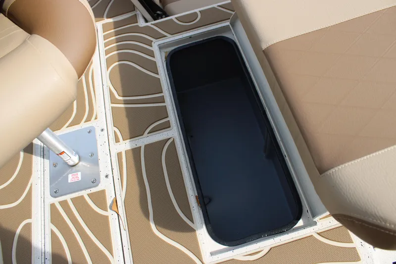 Slide: The Image of 2025 Xpress H22B boat interior with storage compartment and patterned flooring. - 11