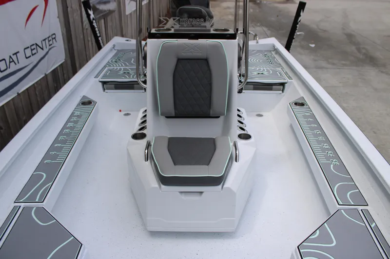 Slide: The Image of 2025 Xpress H22B boat interior with sleek seating and modern design. - 12