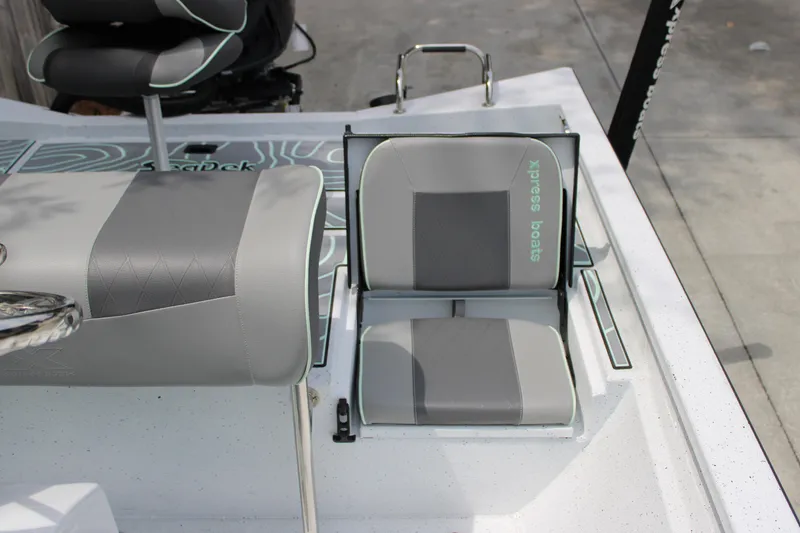 Slide: The Image of 2025 Xpress H22B boat seat with gray and white upholstery. - 20