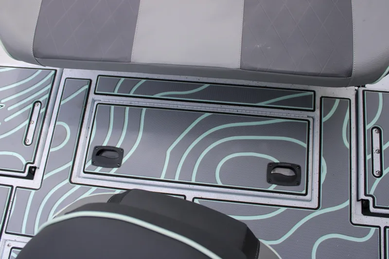 Slide: The Image of 2025 Xpress H22B boat interior with stylish patterned flooring and seating. - 25
