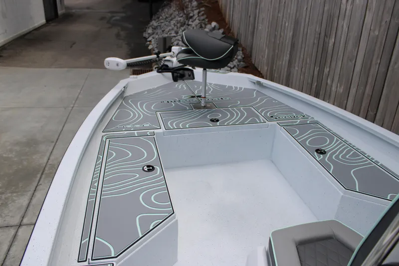 Slide: The Image of 2025 Xpress H22B boat deck with modern seating and storage compartments. - 5