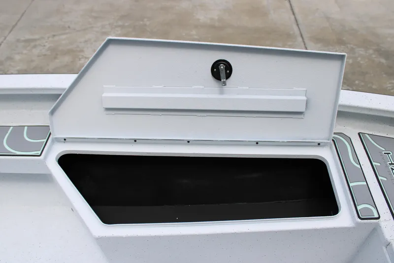 Slide: The Image of Open storage compartment on 2025 Xpress H22B boat. - 9