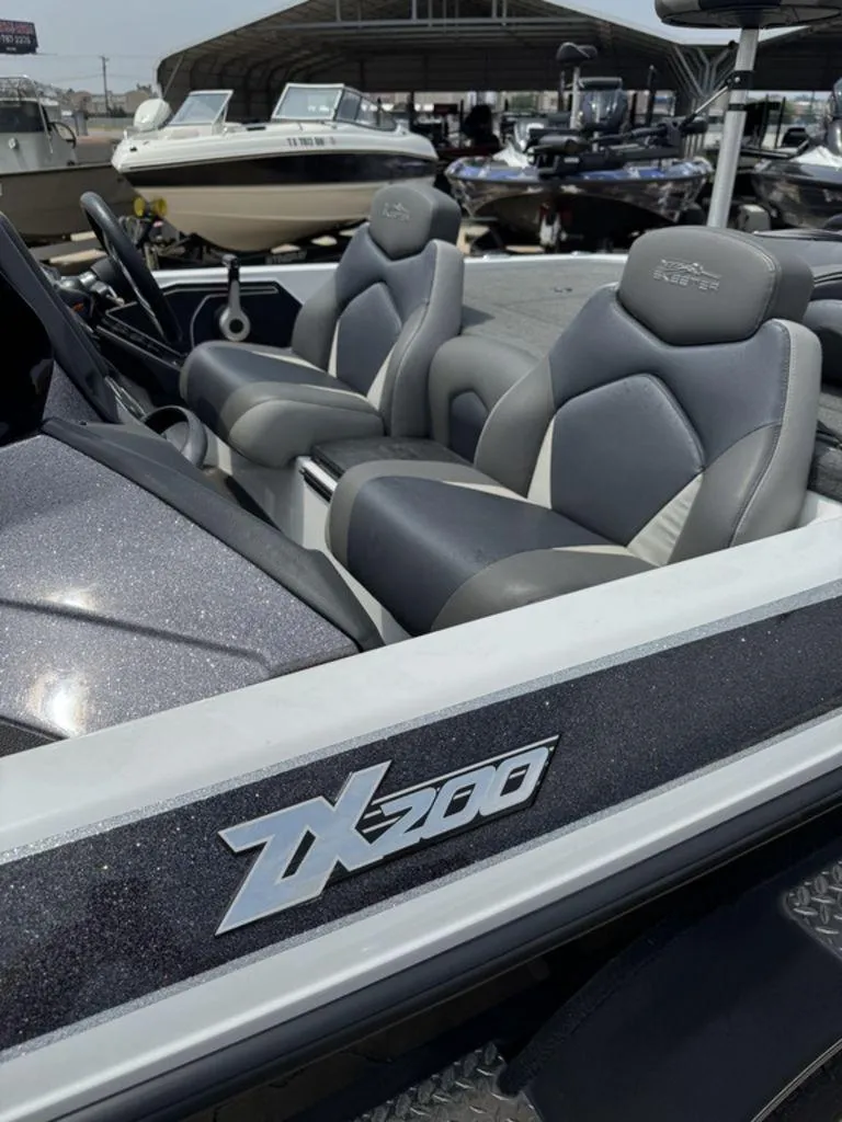 Slide: The Image of 2017 Skeeter ZX200 boat interior with sleek seating and logo detail. - 3