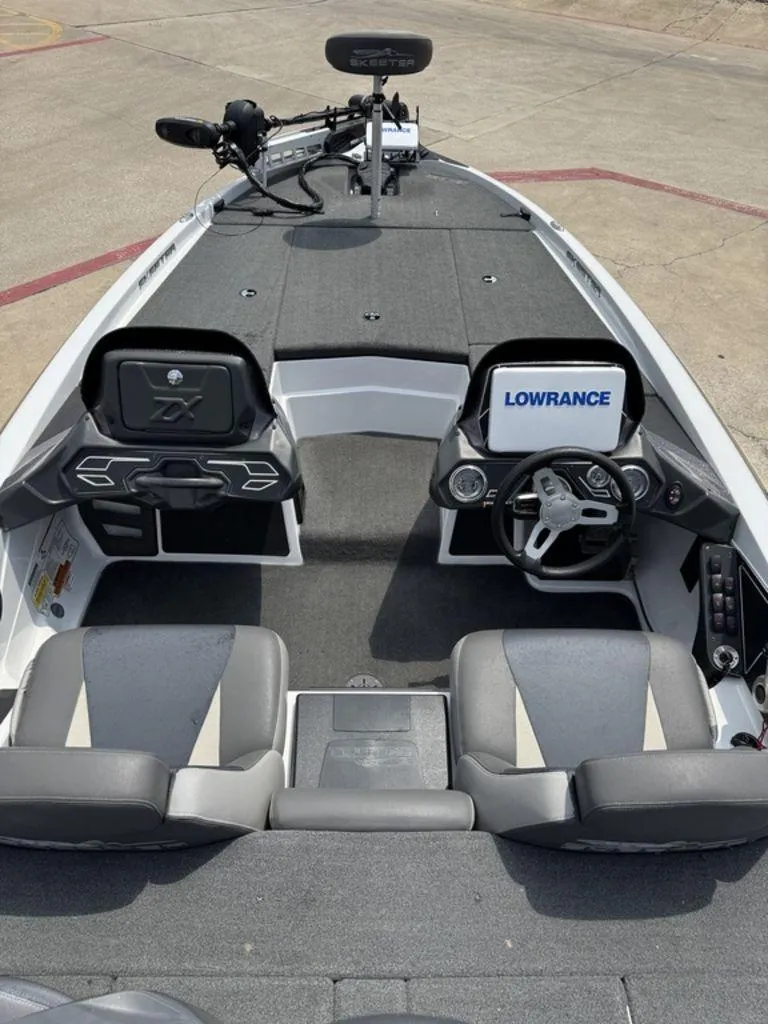 Slide: The Image of 2017 Skeeter ZX200 boat interior with Lowrance electronics and dual seating. - 4