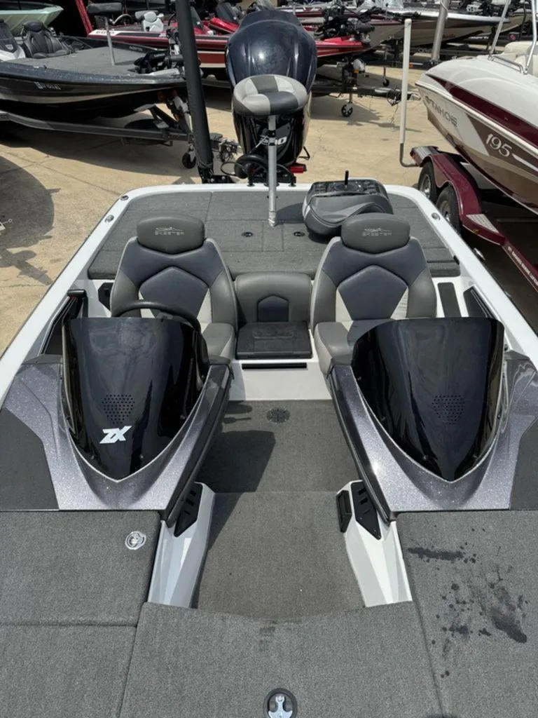 Slide: The Image of 2017 Skeeter ZX200 boat interior with dual seats and sleek design. - 6