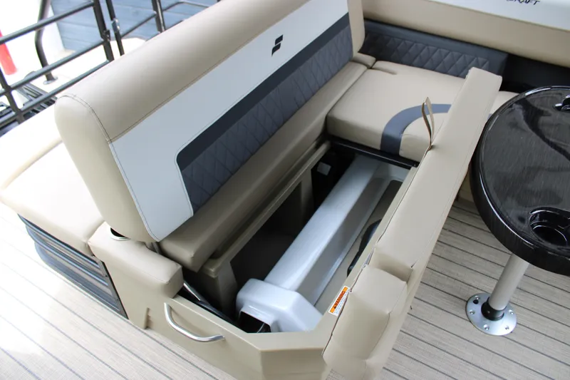 Slide: The Image of 2025 Starcraft SLS-3 Q DH boat interior with open storage compartment and seating. - 19