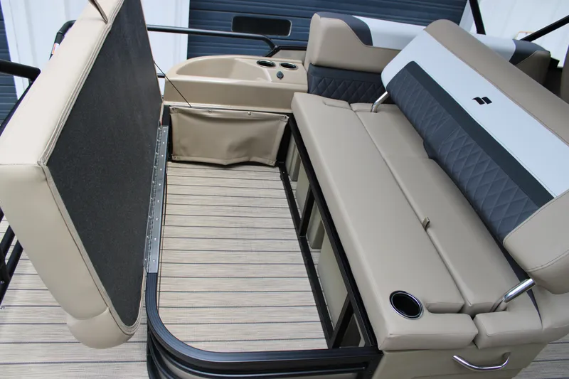 Slide: The Image of 2025 Starcraft SLS-3 Q DH boat interior with beige seating and storage area. - 21