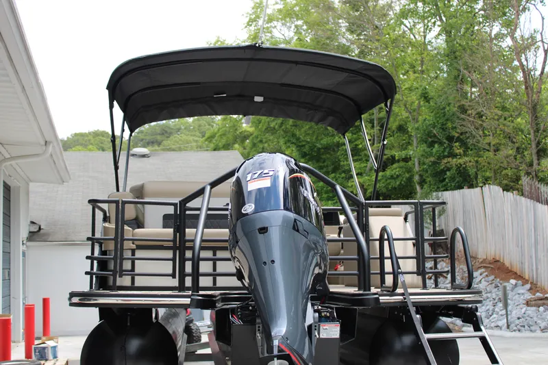 Slide: The Image of 2025 Starcraft SLS-3 Q DH pontoon boat with canopy and powerful outboard motor. - 3