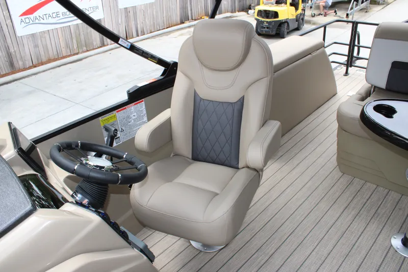 Slide: The Image of Luxurious seating on 2025 Starcraft SLS-3 Q DH boat, featuring beige and gray upholstery. - 5