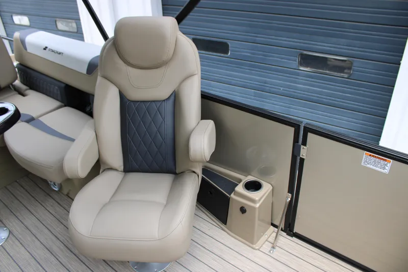 Slide: The Image of Luxurious seating in 2025 Starcraft SLS-3 Q DH boat, featuring beige and black upholstery. - 6