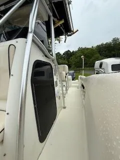 Slide: The Image of 2002 Hydra-Sports 2390 CC Vector boat, side view, featuring sleek design and sturdy construction. - 17