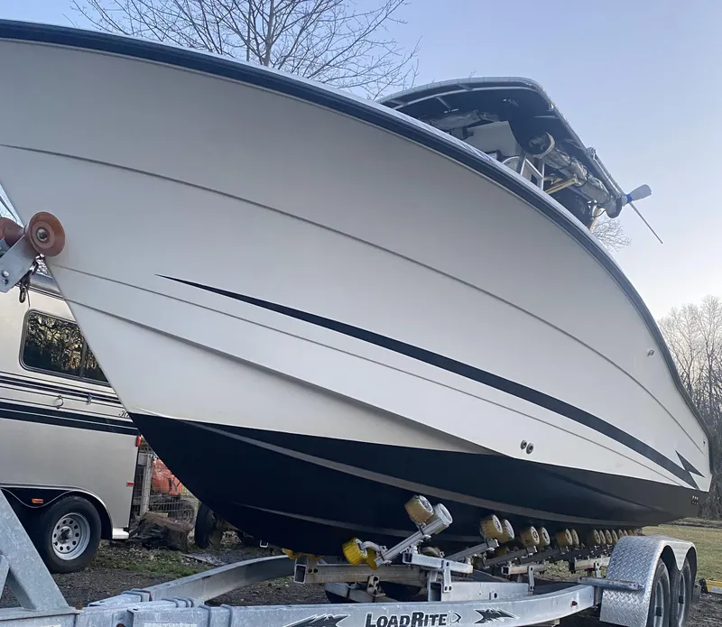 Slide: The Image of 2002 Hydra-Sports 2390 CC Vector boat on trailer, side view. - 21