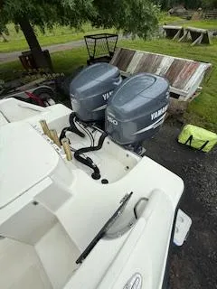 Slide: The Image of 2002 Hydra-Sports 2390 CC Vector with dual Yamaha outboard motors, parked outdoors. - 28