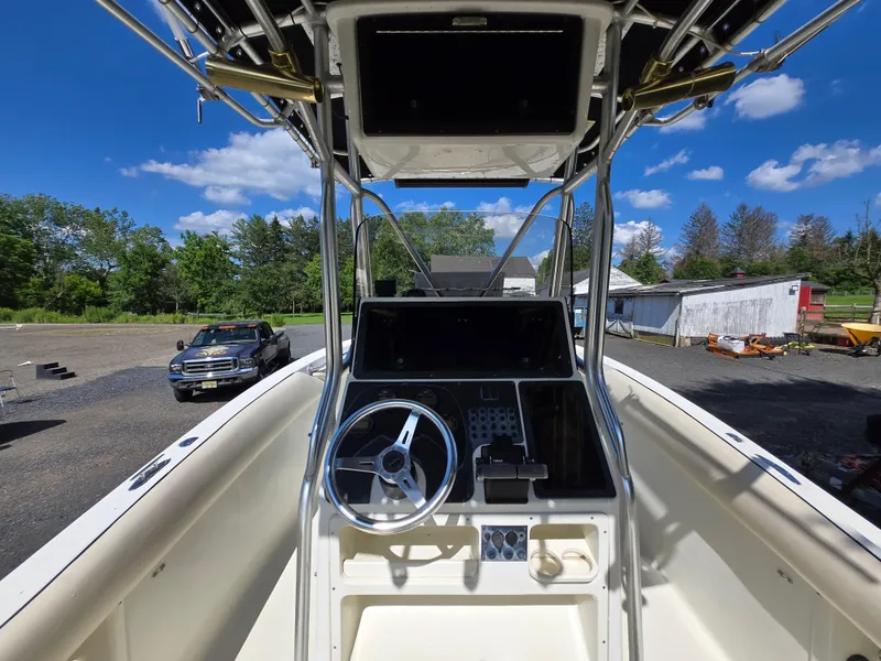 Slide: The Image of 2002 Hydra-Sports 2390 CC Vector boat cockpit with steering wheel and controls, outdoors. - 37