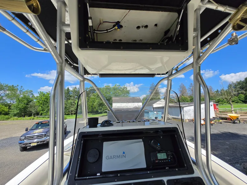 Slide: The Image of 2002 Hydra-Sports 2390 CC Vector boat console with Garmin navigation system, parked outdoors. - 39